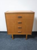 A mid 20th century teak four drawer chest