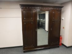 A late Victorian mahogany triple door wardrobe by Robson of Newcastle, width 197 cm,