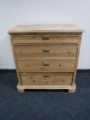 An antique pine four drawer chest