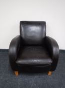 A brown leather lounge chair
