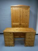 A pine double door wardrobe 96.5 cm x 183 cm x 54 cm.