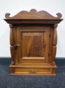 An antique style wooden wall cabinet fitted a drawer