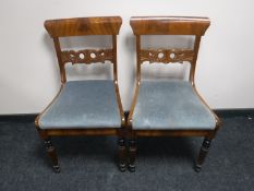 A pair of mahogany dining chairs on reeded legs