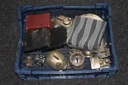 A blue crate containing novelty money boxes,