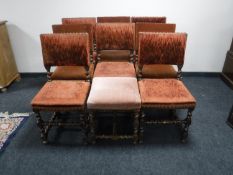 A set of eight carved oak dining chairs and a stool