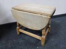 A light oak flap sided small table