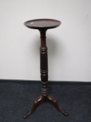 A Victorian mahogany torchere