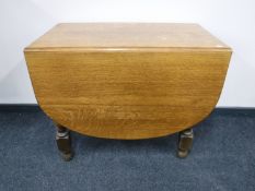 A 1920's oak gate leg table