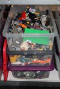 Three crates of Lego and similar building materials, plastic toy items etc.
