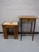 A nest of tiled topped table and an occasional table fitted a drawer