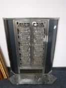 A metal double door fire front