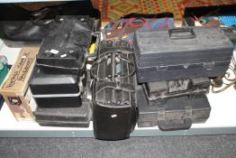 A collection of power tools, case of camera hand books, leather case of tools,