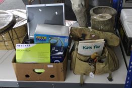 A fishing bag containing various fishing tackle, together with a box containing boxed router,