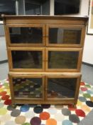 An Edwardian oak stacking three tier bookcase