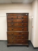 A George III mahogany eight drawer double chest on bracket feet
