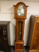 A contemporary yew wood regulator clock