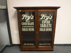 A Victorian and later stained pine bookcase 'Fry's Milk Chocolate'
