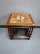 A nest of G plan teak tile topped tables