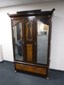 A Victorian and walnut triple door wardrobe