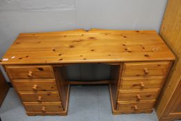 A pine twin pedestal desk
