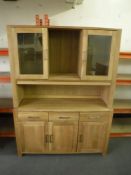 A contemporary light oak kitchen dresser