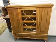 An early twentieth century light oak bookcase,