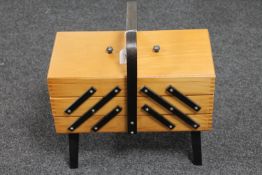 A teak concertina sewing box