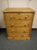 A contemporary pine four drawer chest