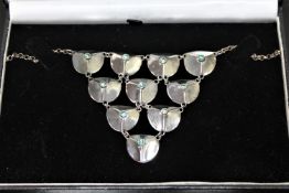 A hand-made silver and green garnet necklace