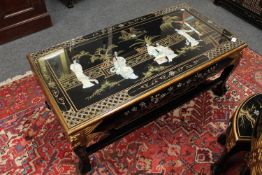 A Japanese rectangular low coffee table with mother of pearl figures