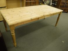 A large pine farmhouse dining table