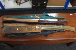 An early twentieth century cricket bat together with an oversized oriental style fan,