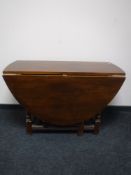 An early 20th century oak gate leg table