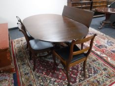 A Regency style dining table with leaf and five chairs