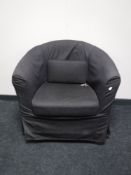 A contemporary grey tub chair