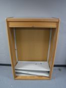 A beech shutter fronted office storage cabinet
