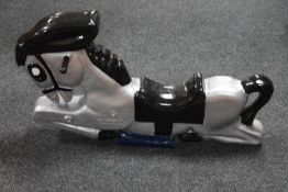 A metal figure of a horse