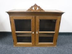 A continental glazed oak cabinet