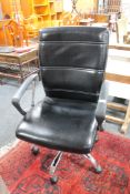 A black leather adjustable office chair