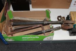 A box of antique stirrup pumps