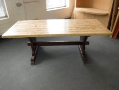 A stripped pine refectory style table