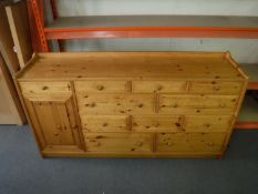 A pine multi drawer sideboard