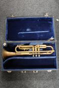 A brass trumpet with mouthpiece