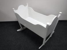 An antique painted pine crib