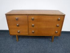 A mid 20th century teak multi drawer chest