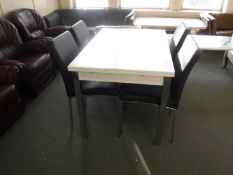 A contemporary white high gloss extending table,