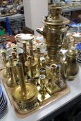 A collection of brass candlesticks, tea urn etc.