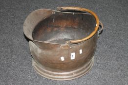 A Victorian copper coal helmet