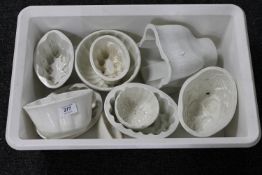 A box of antique ceramic pie moulds