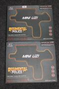 Two boxed Regimental Police mini uzi toy guns